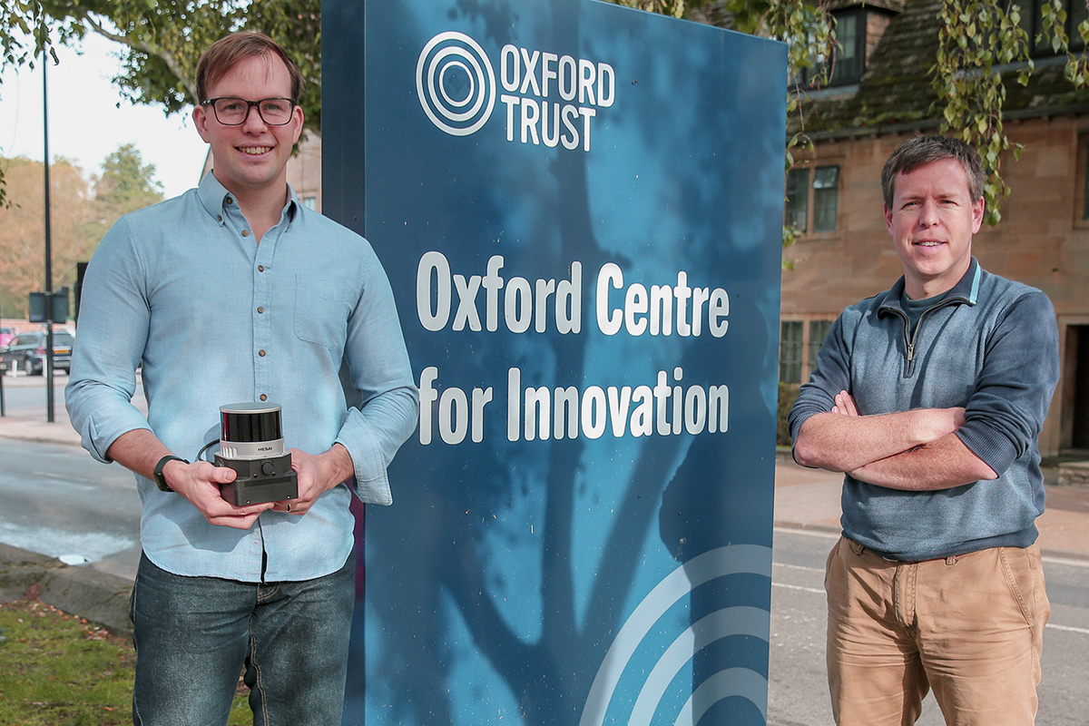 David Wisth (l) and Maurice Fallon (r) on either side of Oxford Centre for Innovation sign