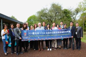 A group of people holding a banner