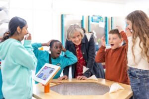 Dame Angela McLean with children from St Francis Church of England School