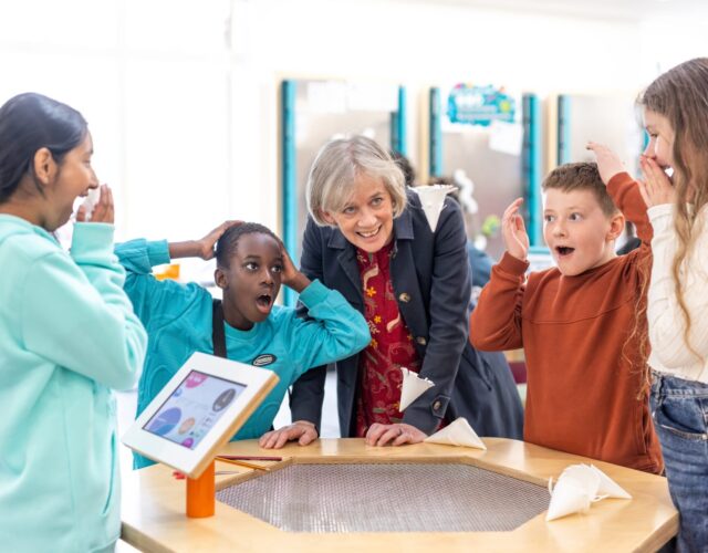 Dame Angela McLean with children from St Francis Church of England School