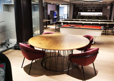A four person meeting table within the co-working area of the Oxford Centre for Innovation at Blue Boar Court