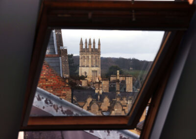 View of the Oxford dreaming spires through a roof window at the Oxford Centre for Innovation