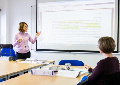Presenting findings of research in a meeting room at the Wood Centre for Innovation