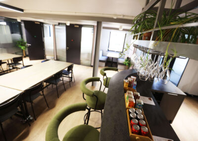 The bar area and co-working tables at the Oxford Centre for Innovation