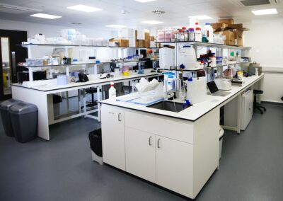 A view of one of the labs at the Wood Centre for Innovation with workspaces and shelves full of scientific equipment.