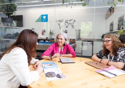 Colleagues in at a meeting within the co-working area in the Barclays Eagle Labs, Wood Centre for Innovation